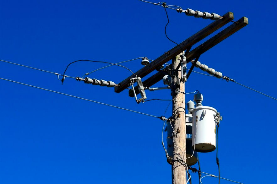 Power lines and power transformer on utility pole