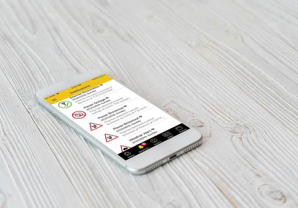 notification-screen-on-table Ting Service App shown on a smart phone laying on a wooden surface