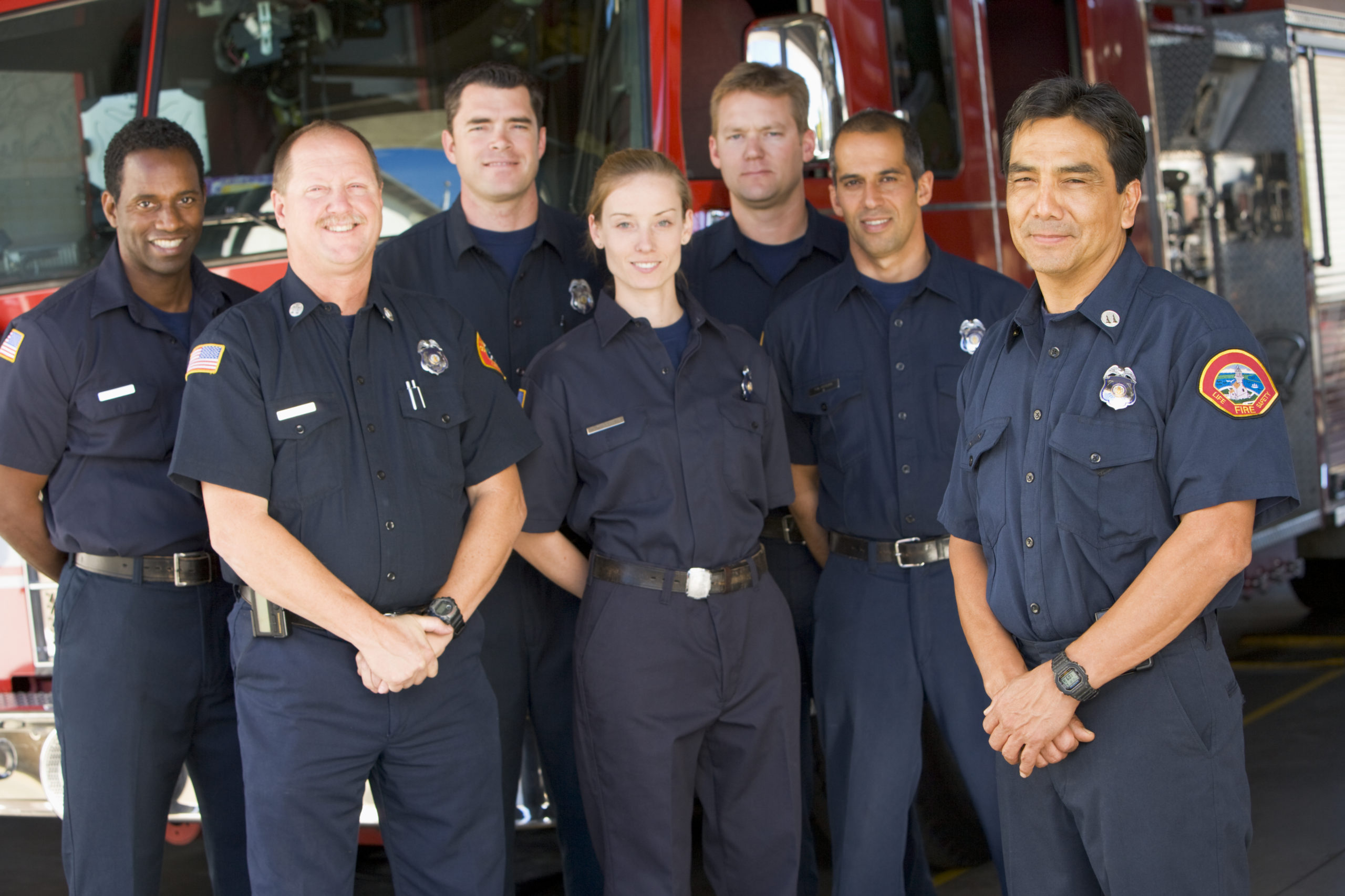 Portrait,Of,Firefighters,Standing,By,A,Fire,Engine