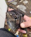 A electrical breaker damaged by arcing at the main panel