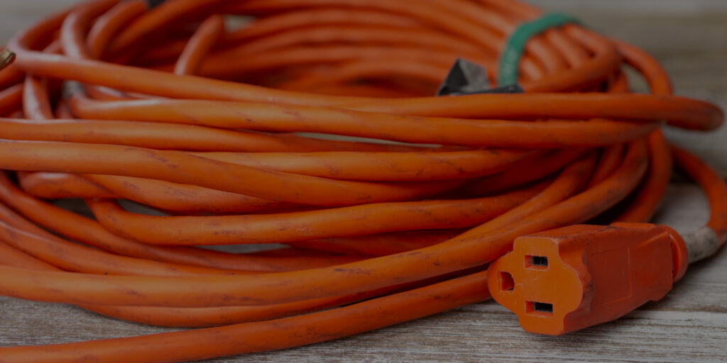 close-up of orange coiled-up extension cord