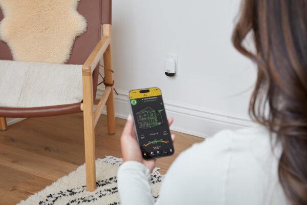 Woman looking at Ting Sensor app